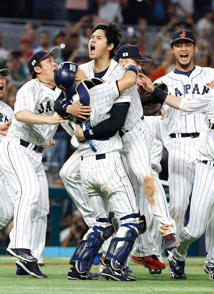 Shohei Ohtani celebrates with teammates after Japan beats U.S. for the WBC title.